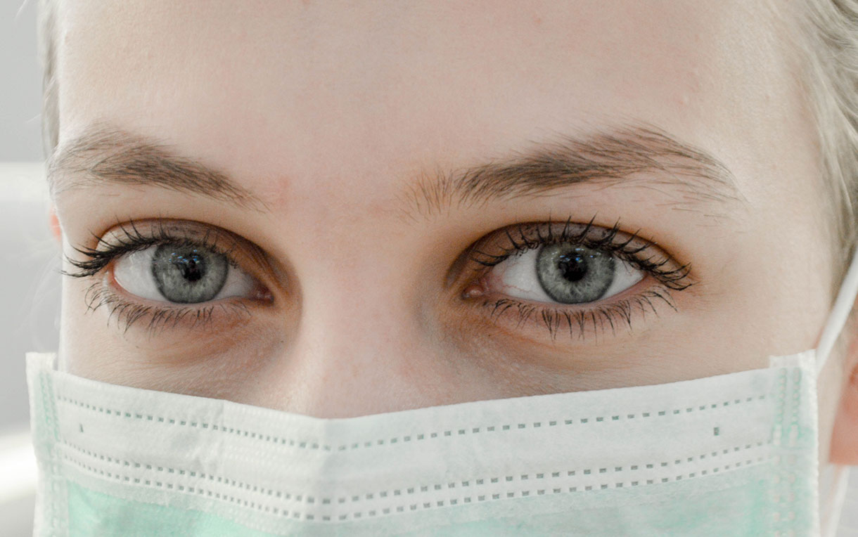 A close-up portrait of a nurse. 